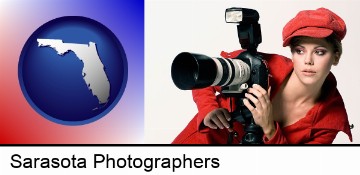 a female photographer with a camera and a tripod in Sarasota, FL