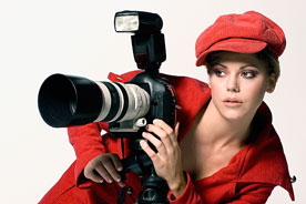 a female photographer with a camera and a tripod