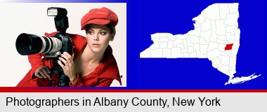 a female photographer with a camera and a tripod; Albany County highlighted in red on a map