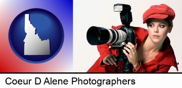 a female photographer with a camera and a tripod in Coeur D Alene, ID