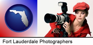 a female photographer with a camera and a tripod in Fort Lauderdale, FL