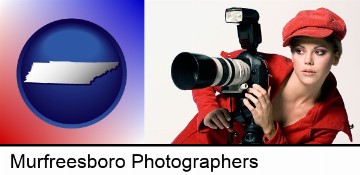 a female photographer with a camera and a tripod in Murfreesboro, TN