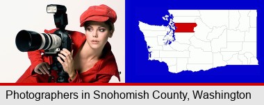 a female photographer with a camera and a tripod; Snohomish County highlighted in red on a map